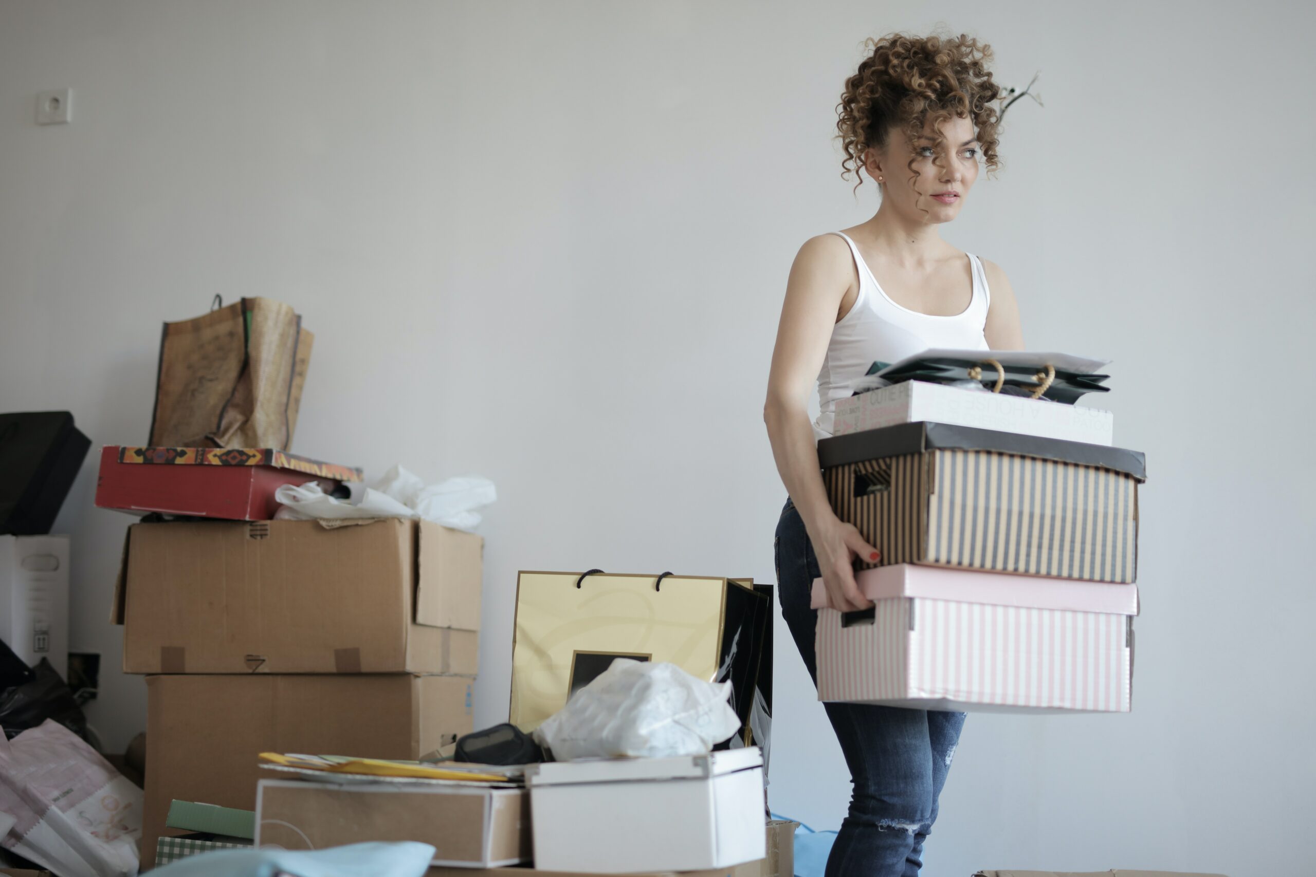 a woman taking out moving boxes
